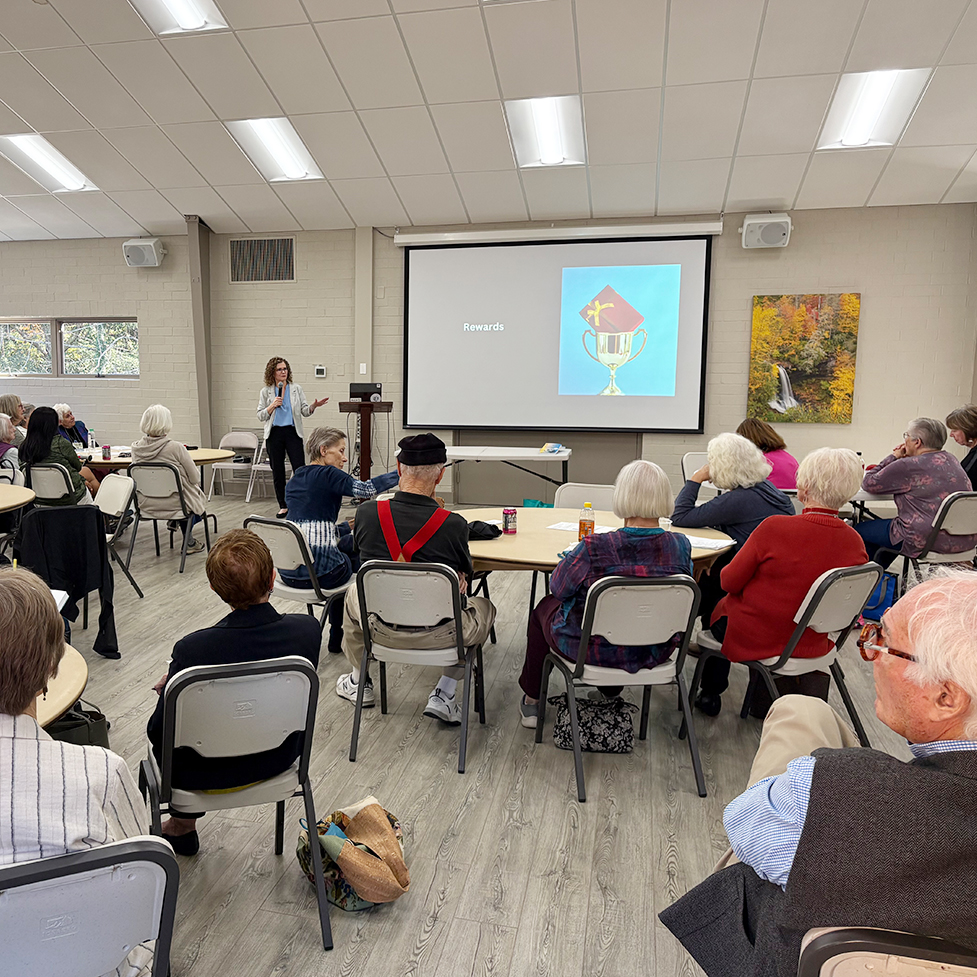 Dr. Corinne Auman speaking to an audience