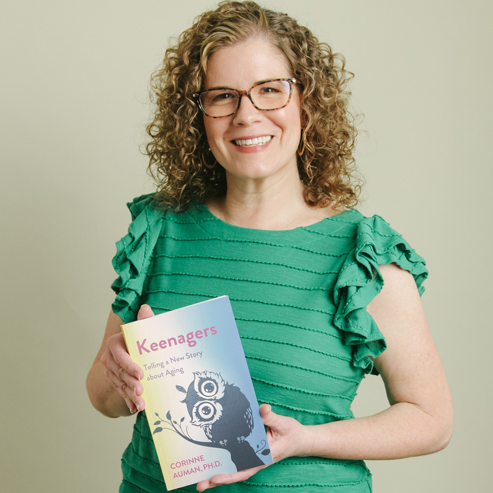 Dr. Auman holding the Keenagers book